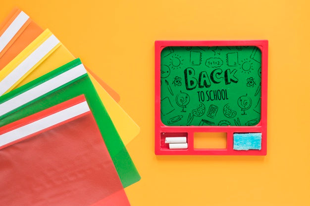 Arrangement With Green Board And Multicoloured Plastic Folders Psd