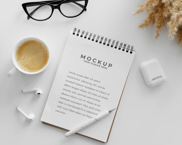 Arrangement With Mock-Up Notepad On A Desk Psd