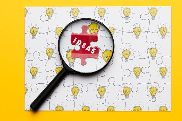 Arrangement With Puzzle And Magnifying Glass Psd