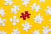 Arrangement With Puzzle Pieces On Yellow Background Psd
