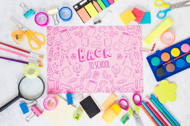 Arrangement With School Supplies Including Magnifying Glass Psd