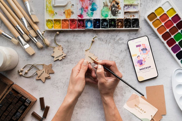 Artist Painting At Desk Psd