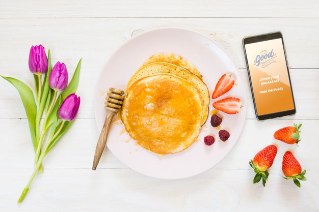 Assortment Of Breakfast Pancakes Next To Smartphone Psd