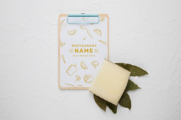 Assortment Of Delicious Cheese With Clipboard Mock-Up Psd