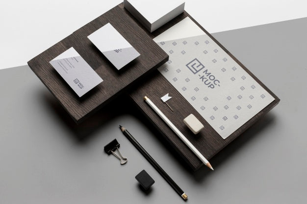 Assortment Of Mock-Up Stationery On Wood Psd