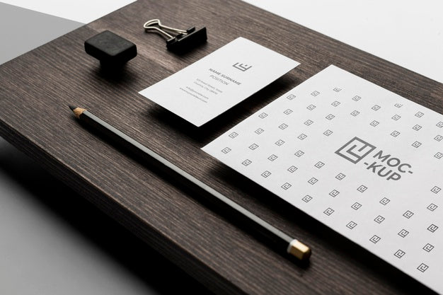Assortment Of Mock-Up Stationery On Wood Psd