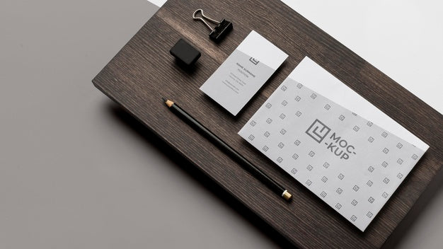 Assortment Of Mock-Up Stationery On Wood Psd