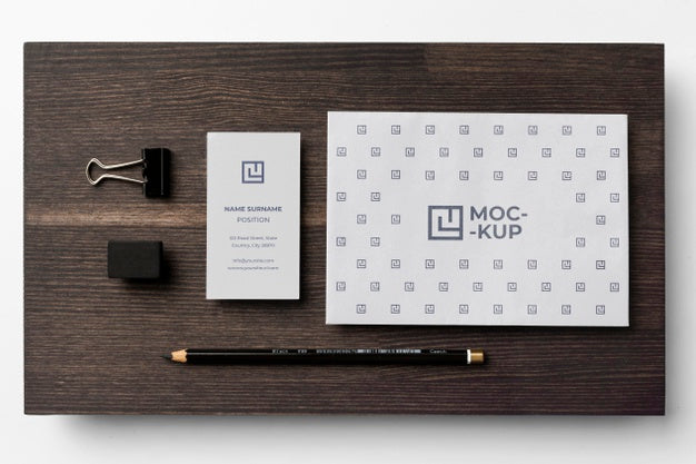 Assortment Of Mock-Up Stationery On Wood Psd