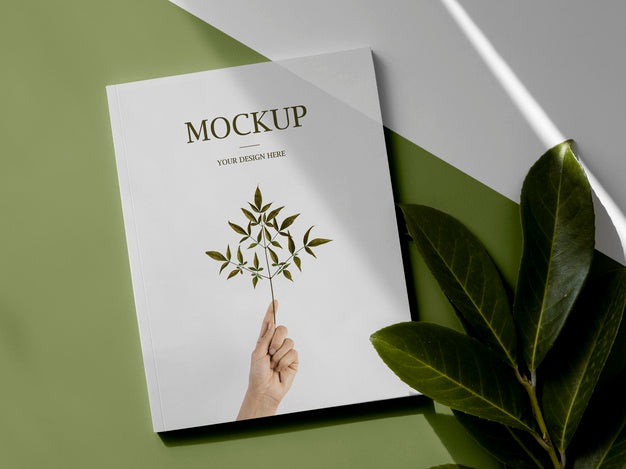 Assortment With Magazine And Leaves Above View Psd