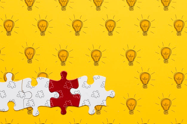 Assortment With Puzzle Pieces On Yellow Background Psd