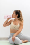 Athletic Woman Drinking Water After Yoga Psd