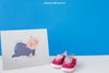 Baby Mockup With Paper And A Pair Of Shoes Psd