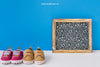 Baby Mockup With Slate And Two Pairs Of Shoes Psd