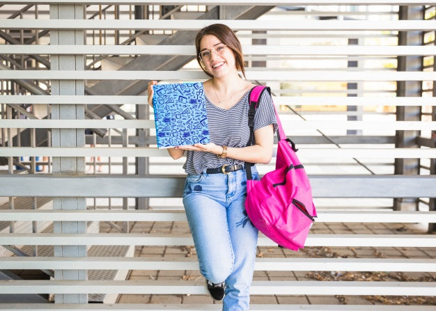 Back To School Concept With Girl Presenting Book Cover Psd
