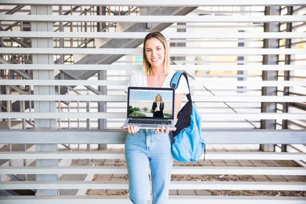 Back To School Concept With Girl Presenting Laptop Psd