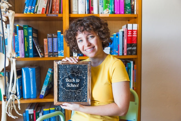 Back To School Concept With Girl Showing Slate Psd