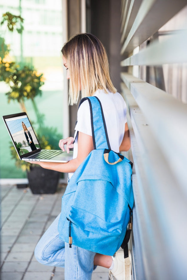 Back To School Concept With Girl Using Laptop Psd