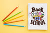 Back To School Mockup With Notebook And Four Pencils Psd