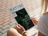 Back View Hands Holding Nature Magazine Mock Up Psd