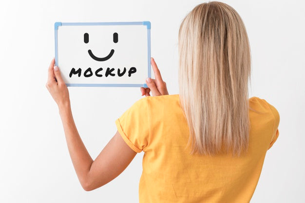 Back View Of Woman Holding Whiteboard Psd