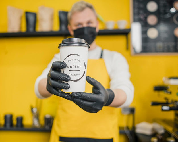 Barista Holding Coffee Cup Mock-Up Psd