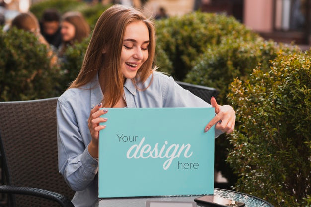 Beautiful Blonde Girl Holding A Banner Mock-Up Psd