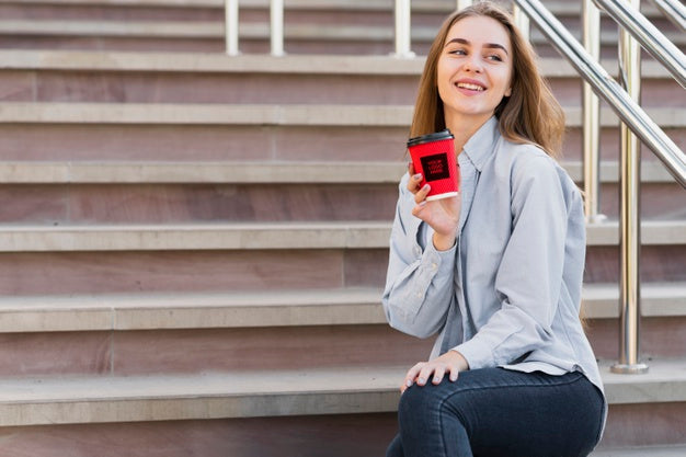 Beautiful Girl Holding A Cup Of Coffee Mock-Up Psd