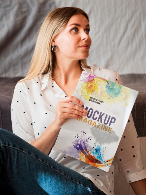 Beautiful Woman Holding A Mock Up Magazine Psd