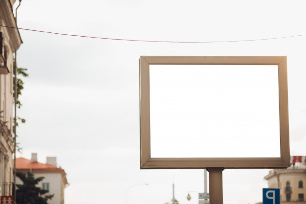 Bilbard With Multi-Colored Advertising And Illumination Stands On The Street In Daylight, Photo Below Psd