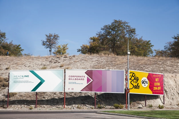 Billboard Mockup In Front Of Hill Psd