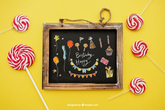 Birthday Concept With Lollipops And Slate Psd