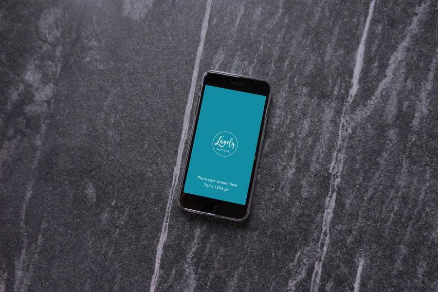 Black iPhone 8 on A Stone Floor