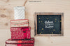Blackboard And Gift Boxes Mockup With Christmtas Design Psd