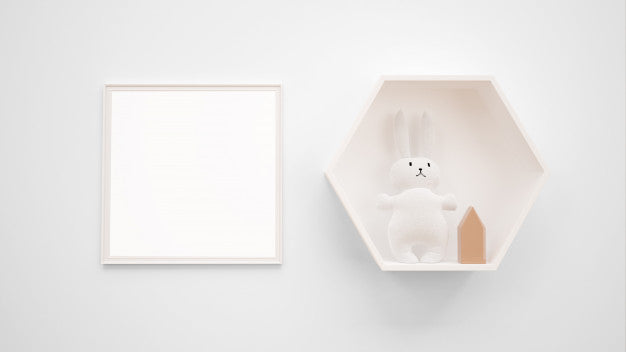 Blank Photo Frame Mockup Hanging On The Wall Next To A Bunny Toy Psd