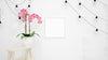 Blank Photo Frame Mockup With Lamps Hanging On White Wall And Beautiful Decorative Pink Flower Psd