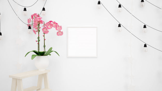 Blank Photo Frame Mockup With Lamps Hanging On White Wall And Beautiful Decorative Pink Flower Psd