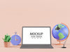 Blank Screen Laptop With World Globe, Lamp, Clock And Plant Psd
