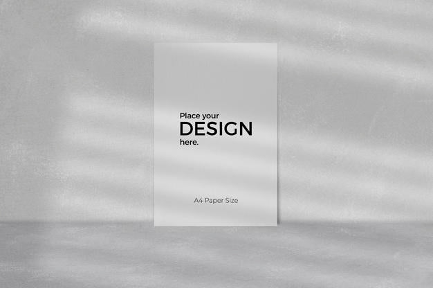 Blank Sheet Editable Template In Front Of Grey Wall Psd