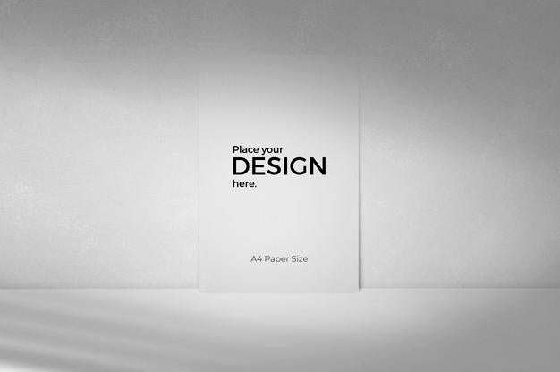 Blank Sheet Editable Template In Front Of Grey Wall Psd