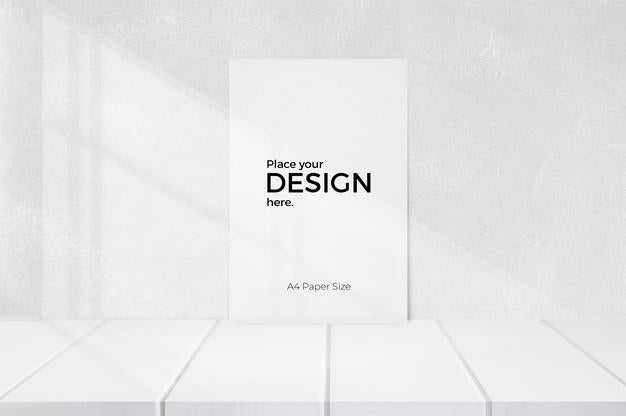 Blank Sheet Editable Template In Front Of White Wall Psd