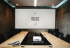 Blank White Projector Screen Mockup In A Meeting Room Psd
