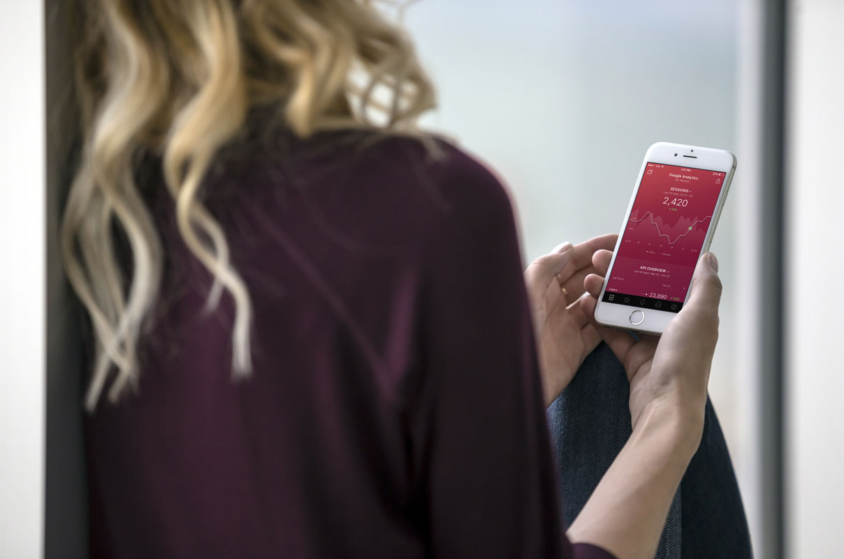 Blond Woman Holding a White iPhone 7 PSD Mockups