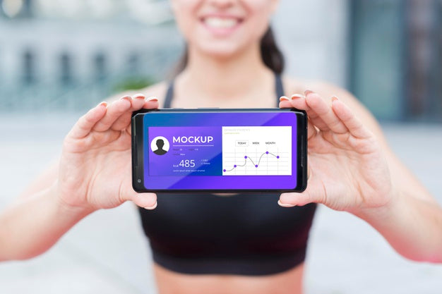 Blurred Fit Woman Holding Mobile Phone Mock-Up Psd