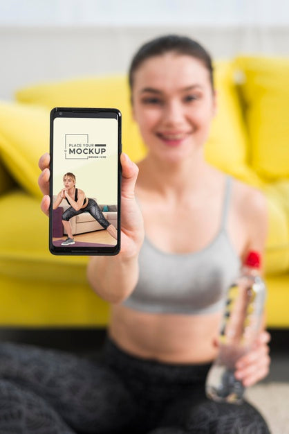 Blurred Woman Holding Water And Mobile Phone Psd