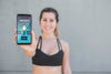 Blurred Woman In Sport Clothes Holding Mobile Mock-Up Psd