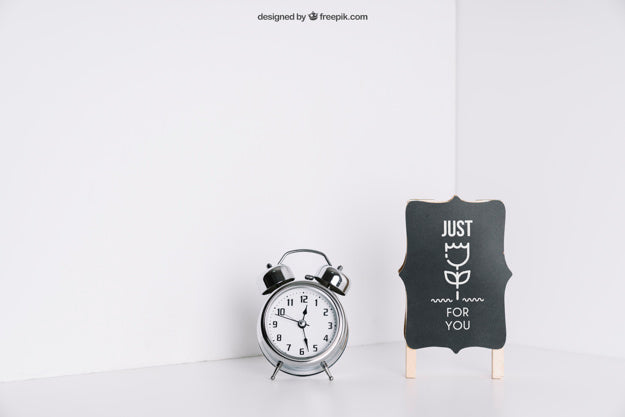 Board And Alarm Clock In Corner Psd