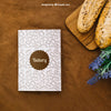 Book Cover Mockup With Bread And Flowers Psd