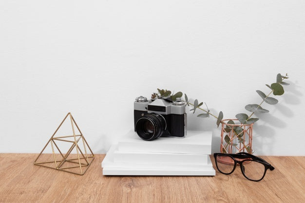 Books, Glasses And Camera Arrangement Psd