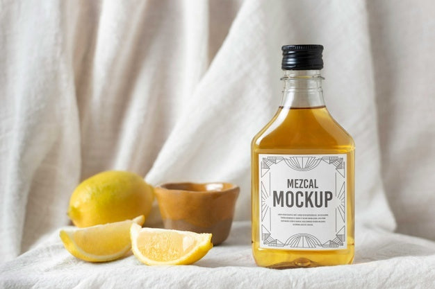 Bottle Of Mezcal Drink With Lemons Psd