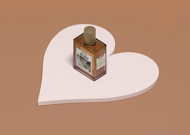 Bottle Of Perfume On Heart Shape Psd